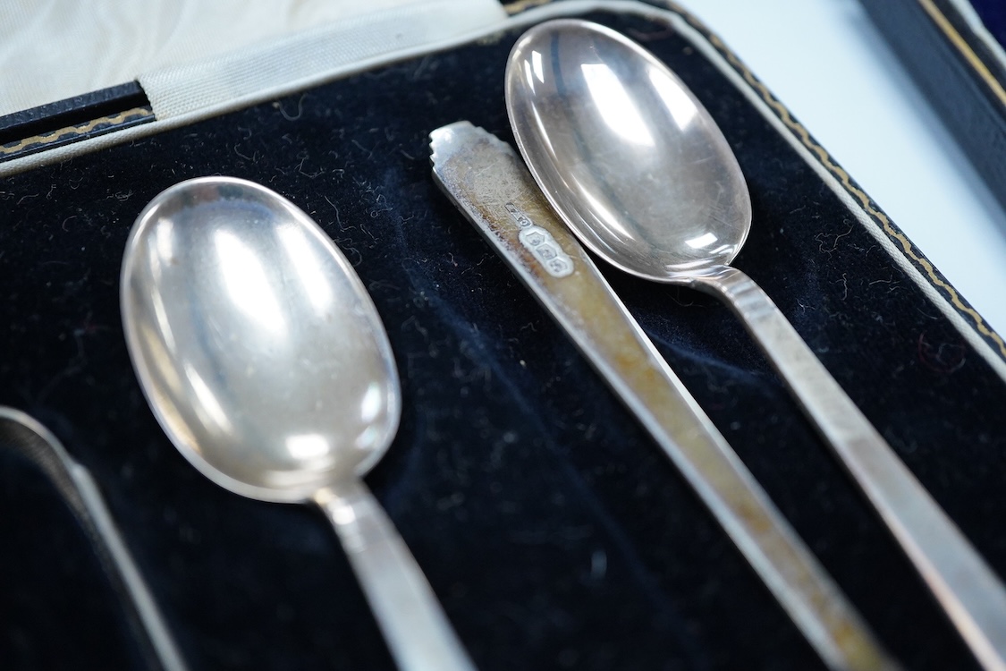 A cased set of six George VI Art Deco silver teaspoons and pair of sugar tongs, by C.W. Fletcher & Son Ltd, Sheffield, 1936, together with a cased set of six silver bean end coffee spoons and a cased set of six plated te